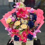 Cadbury Dairy Milk & Mixed Floral Basket Arrangement