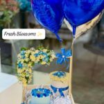 Balloons and fresh flowers bascket