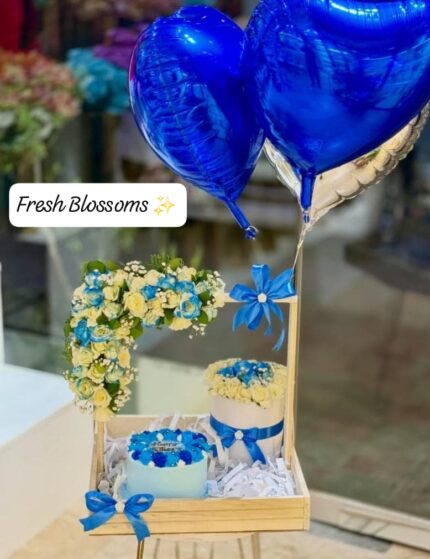 Balloons and fresh flowers bascket